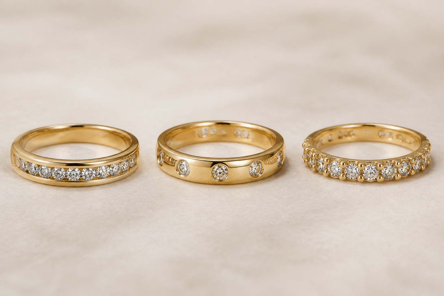 Yellow-gold diamond bands showing channel, flush, and bead-set construction